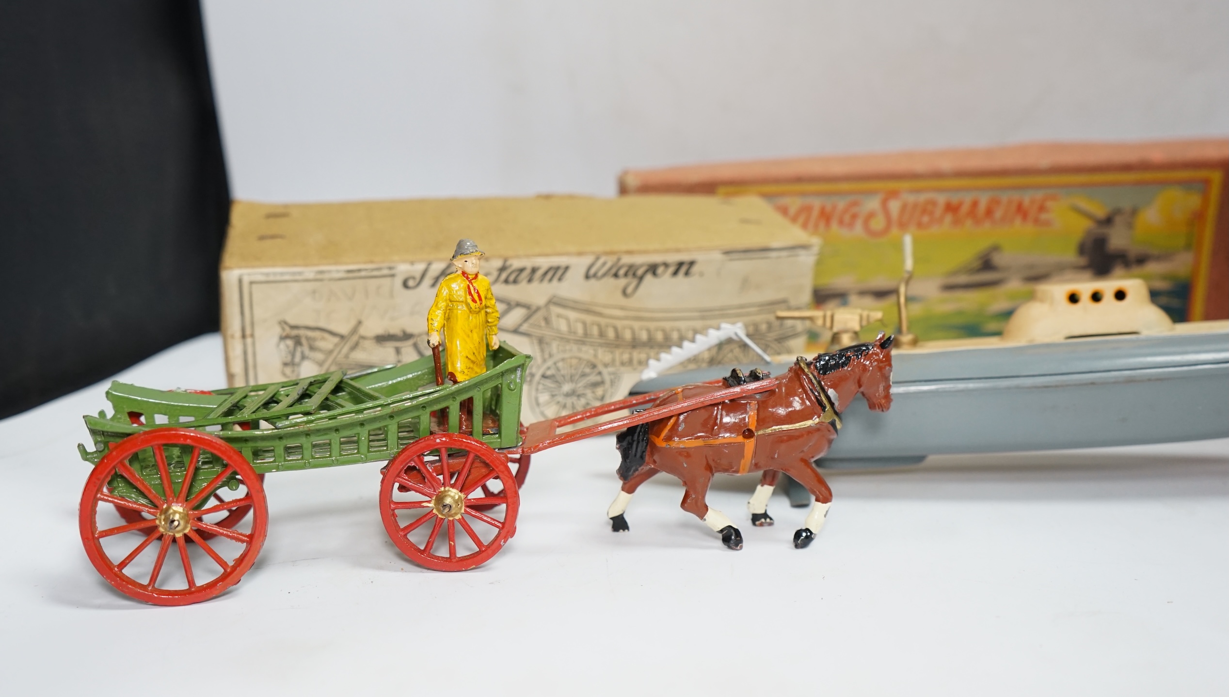 Three boxed 1930s toys; a Johillco Miniature Stage Coach, a Charbens (Set; 503) The Farm Wagon, and a CK, Japan, Diving Submarine in grey-blue finish with Union flag and friction drive motor. Condition - fair to good.